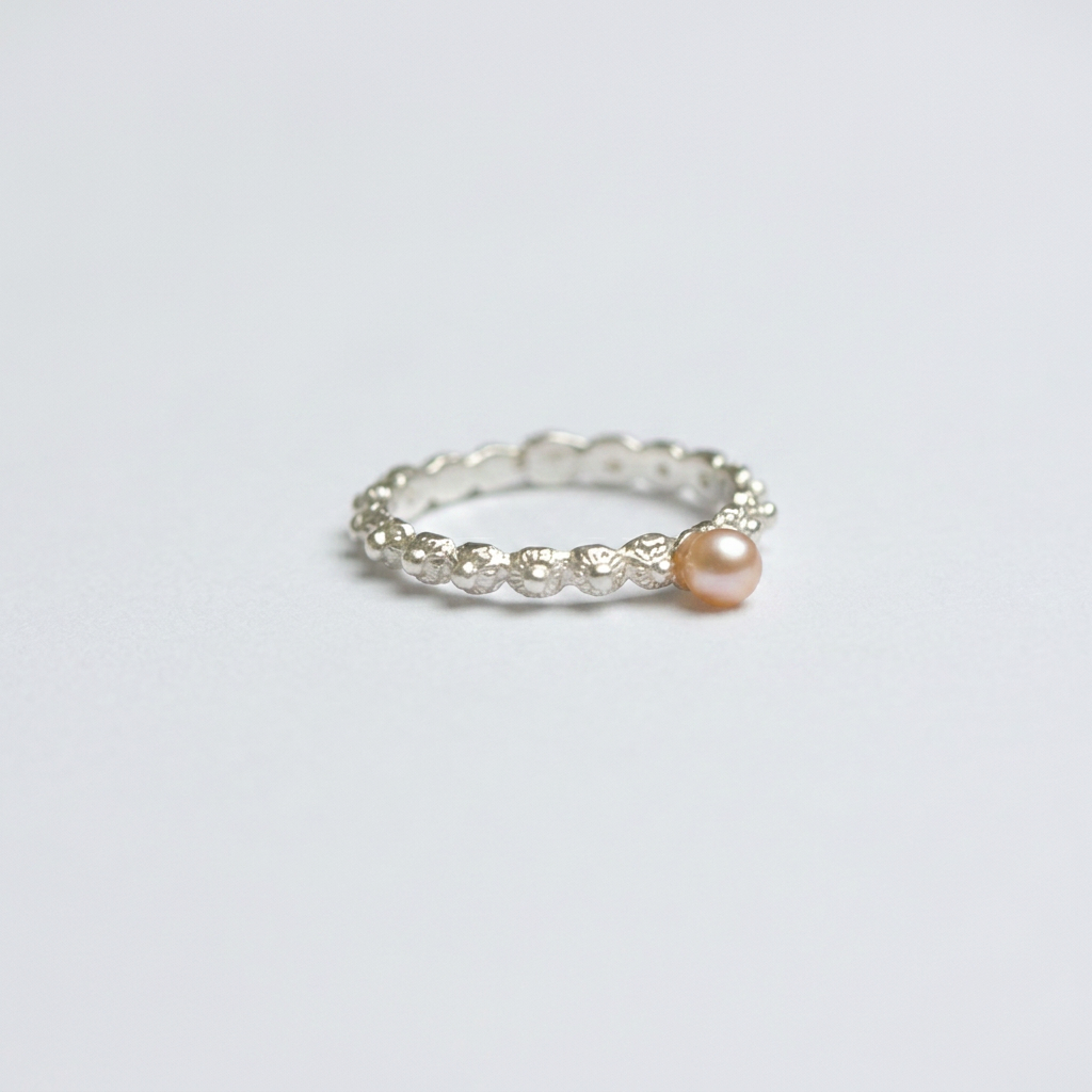 Einzigartiger silberner Schiebering mit rosa Perle | Zeelandknoten